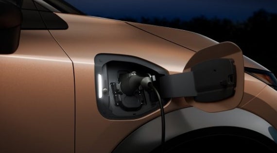 Close-up image of charging cable plugged in | Carlock Nissan of Jackson in Jackson TN