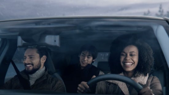Three passengers riding in a vehicle and smiling | Carlock Nissan of Jackson in Jackson TN